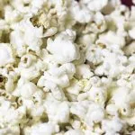 Close-up of fluffy white popcorn kernels piled together.